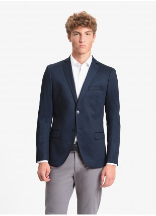John Barritt man jacket, slim fit, full body lining, two buttons, double vent, flap pockets, amf. Stretch jersey fabric. Color blue. Composition 53% polyester 43% viscose 4% elastane. Blue