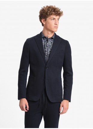 John Barritt man jacket, slim fit, full body lining, two buttons, double vent, patch pockets, amf. Jersey fabric, color blue. Composition 100% cotton. Blue
